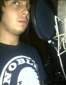 Artist in a Noble Savage T-shirt in a recording studio